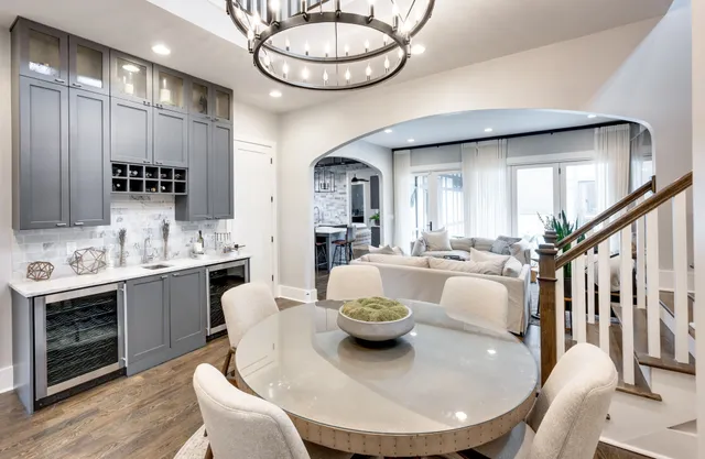 a living room with furniture and a large mirror