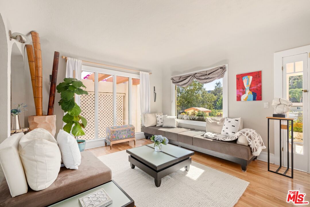 680 Glenmore Boulevard Glendale, CA 91206 - Photo 4 of 15 a living room with furniture and a large window