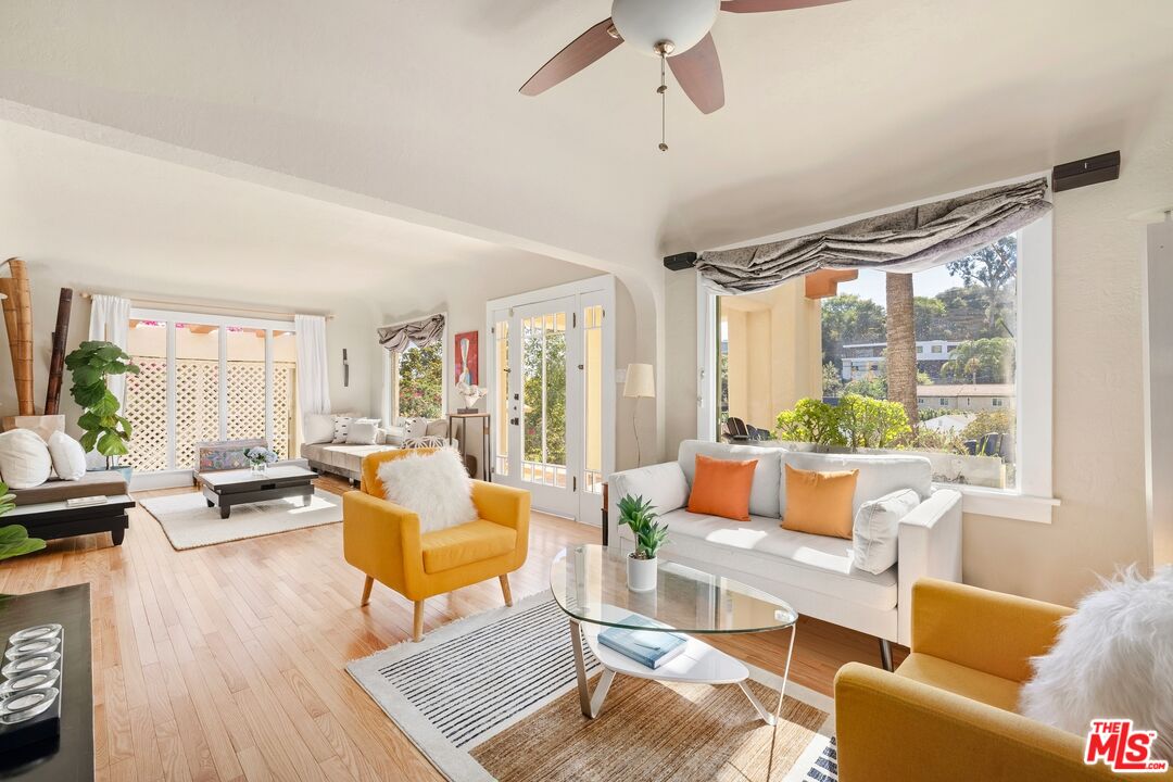 680 Glenmore Boulevard Glendale, CA 91206 - Photo 5 of 15 a living room with furniture and a large window