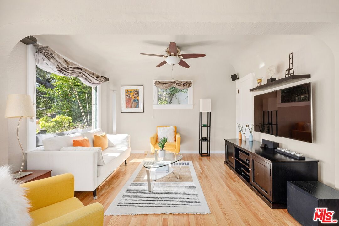 680 Glenmore Boulevard Glendale, CA 91206 - Photo 6 of 15 a living room with furniture and a flat screen tv