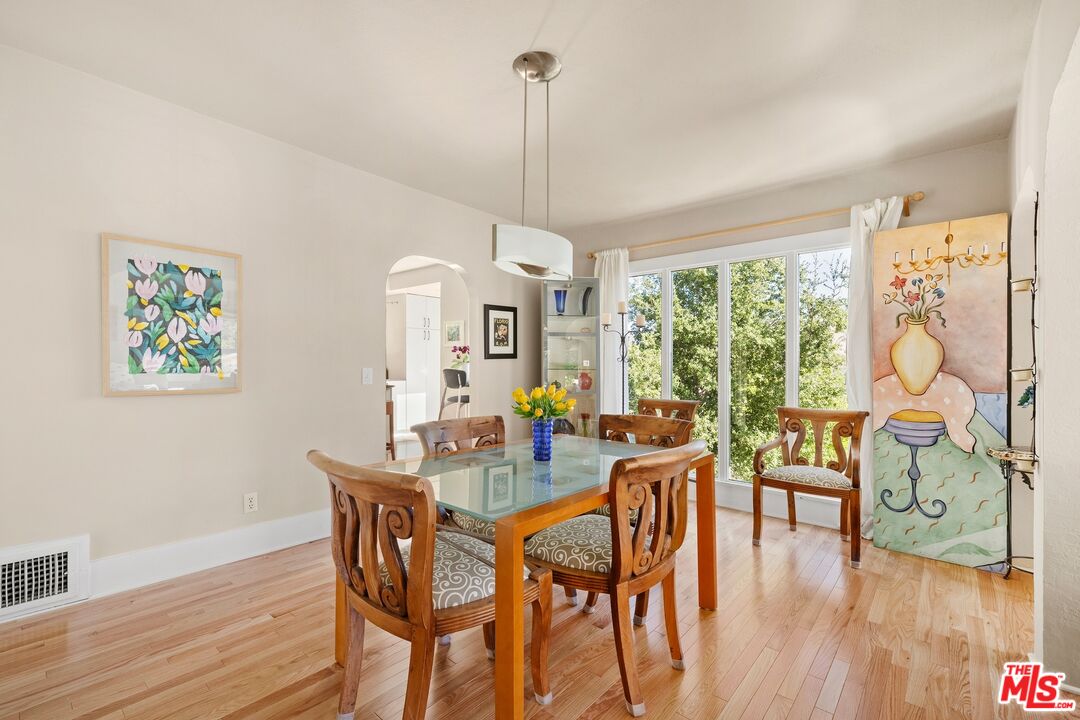 680 Glenmore Boulevard Glendale, CA 91206 - Photo 7 of 15 a view of a dining room with furniture window and wooden floor