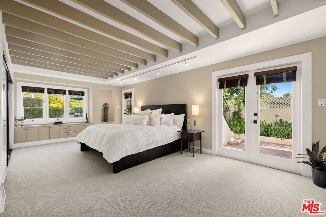 680 Glenmore Boulevard Glendale, CA 91206 - Photo 10 of 15 a bed sitting in a spacious bedroom next to a window