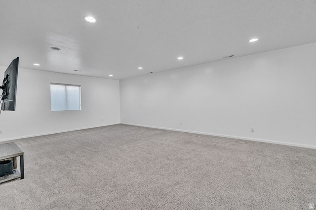 3269 West 650 North Layton, UT 84041 - Photo 19 of 35 Spacious room featuring light gray carpeting, recessed ceiling lighting, a single window with a privacy screen, and white painted walls