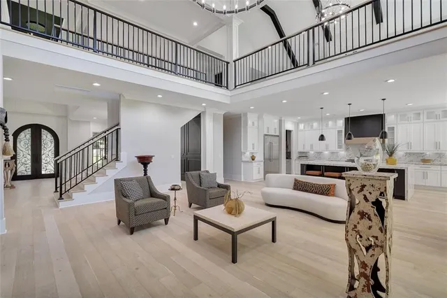 a kitchen with stainless steel appliances kitchen island wooden cabinets a stove and a sink