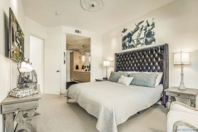 a bedroom with a bed and a table