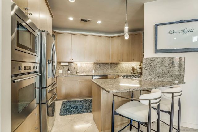 a kitchen with a refrigerator and countertop