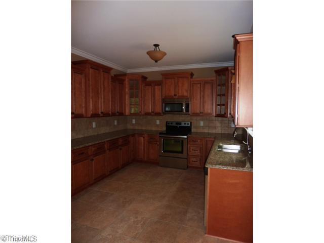 5036 Peppertree Road Clemmons, NC 27012 - Photo 5 of 16 Kitchen. You will love having friends over in this great Kitchen with granite counter, tumble tile backspash, lots of counters and cabinets space, tile floor, ss appliances and so much more.