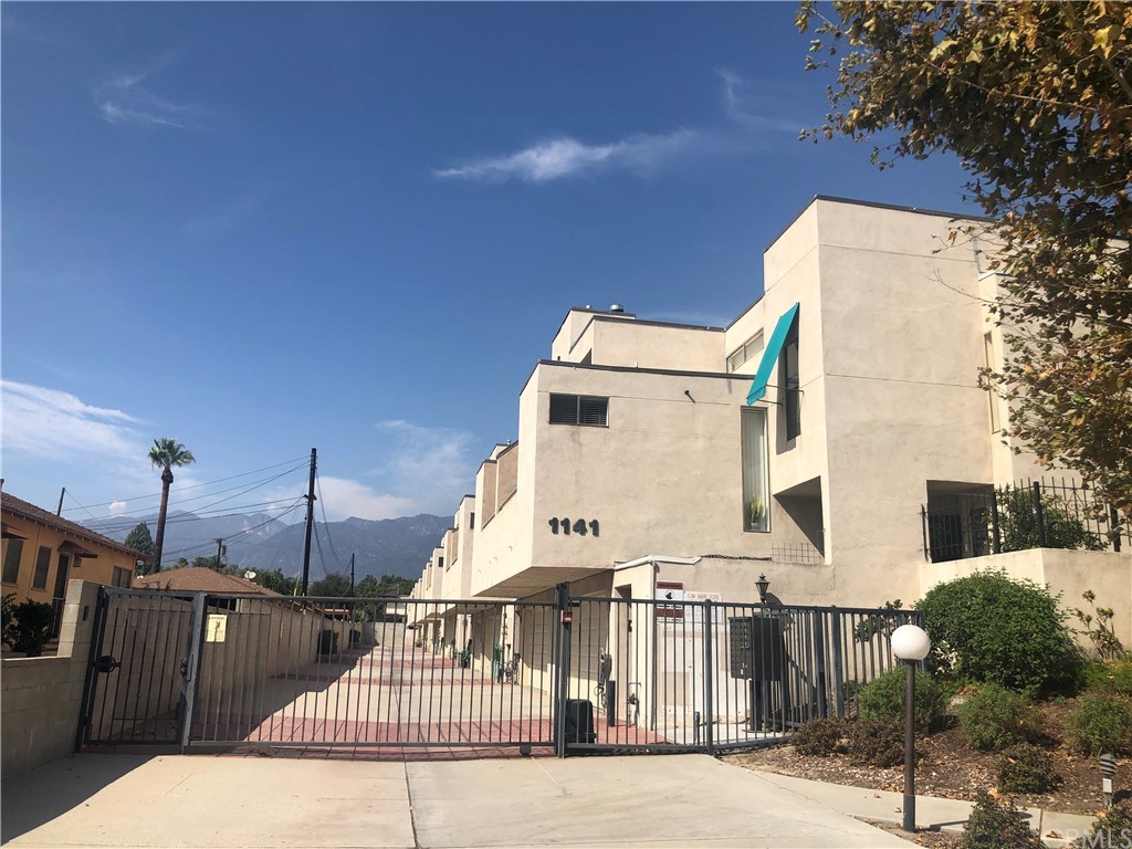 a view of a brick building with many windows