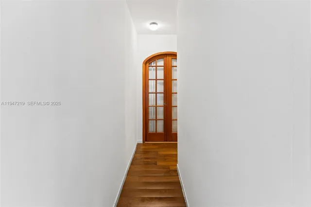 a view of a hallway with an entryway