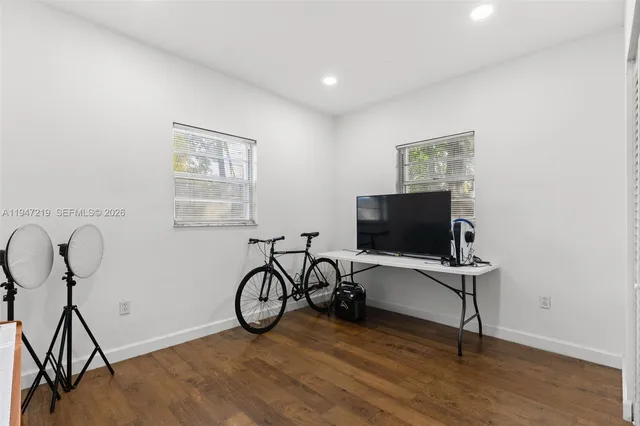 a view of a livingroom with furniture and wooden floor