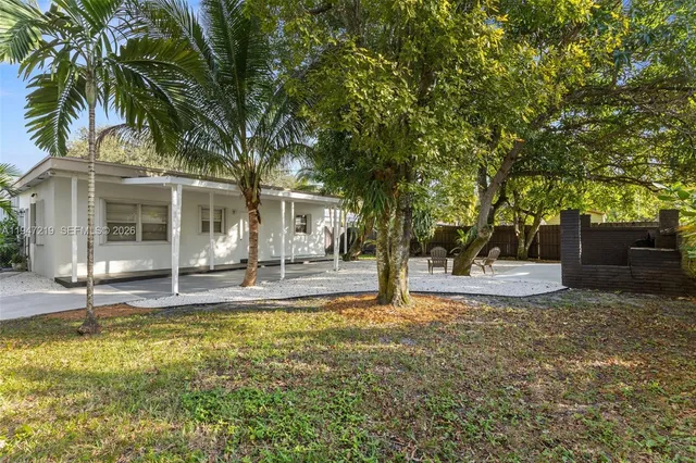 a house with trees in front of it