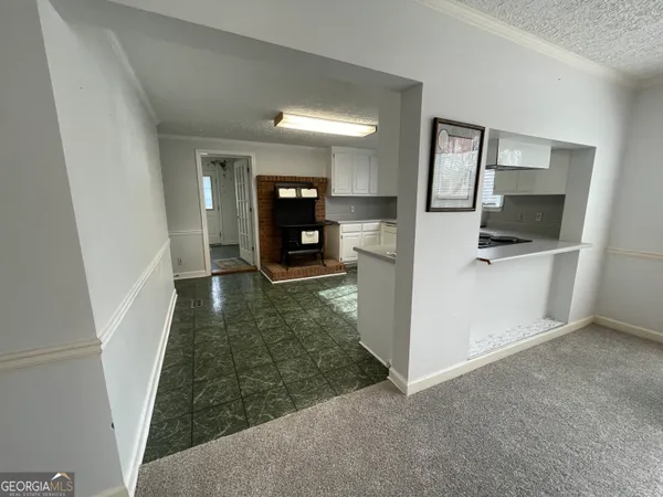 a bathroom with a toilet sink and a mirror