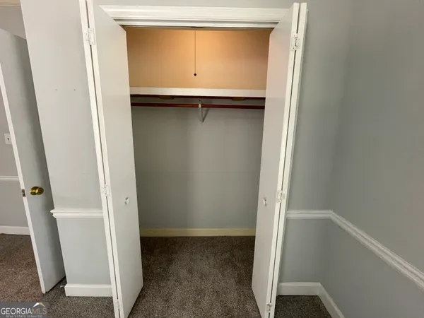 a bathroom with a shower and a sink