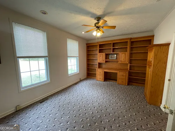 a bathroom with a double vanity sink toilet and shower
