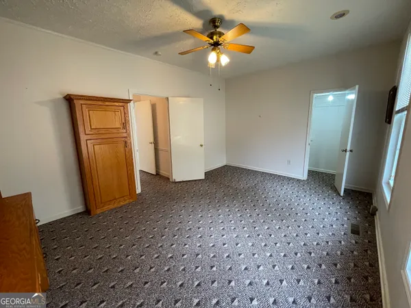a view of a patio with table and chairs potted plants with wooden floor