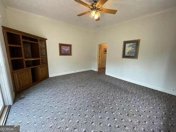 a view of balcony with wooden floor and fence