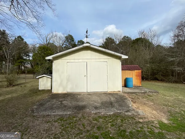 a view of garage and yard