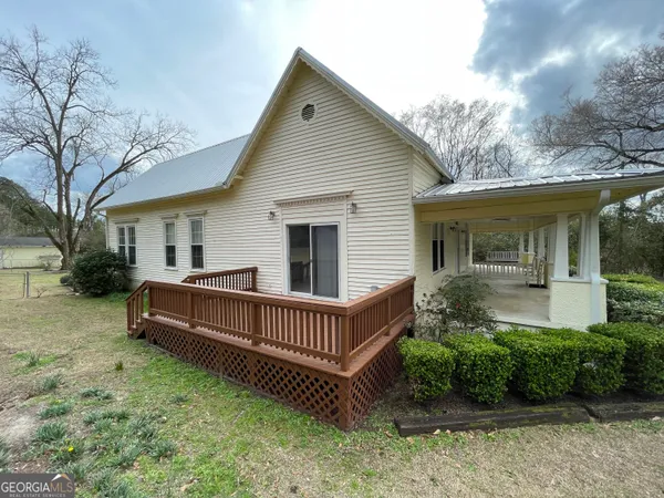a view of a livingroom with furniture and a flat screen tv