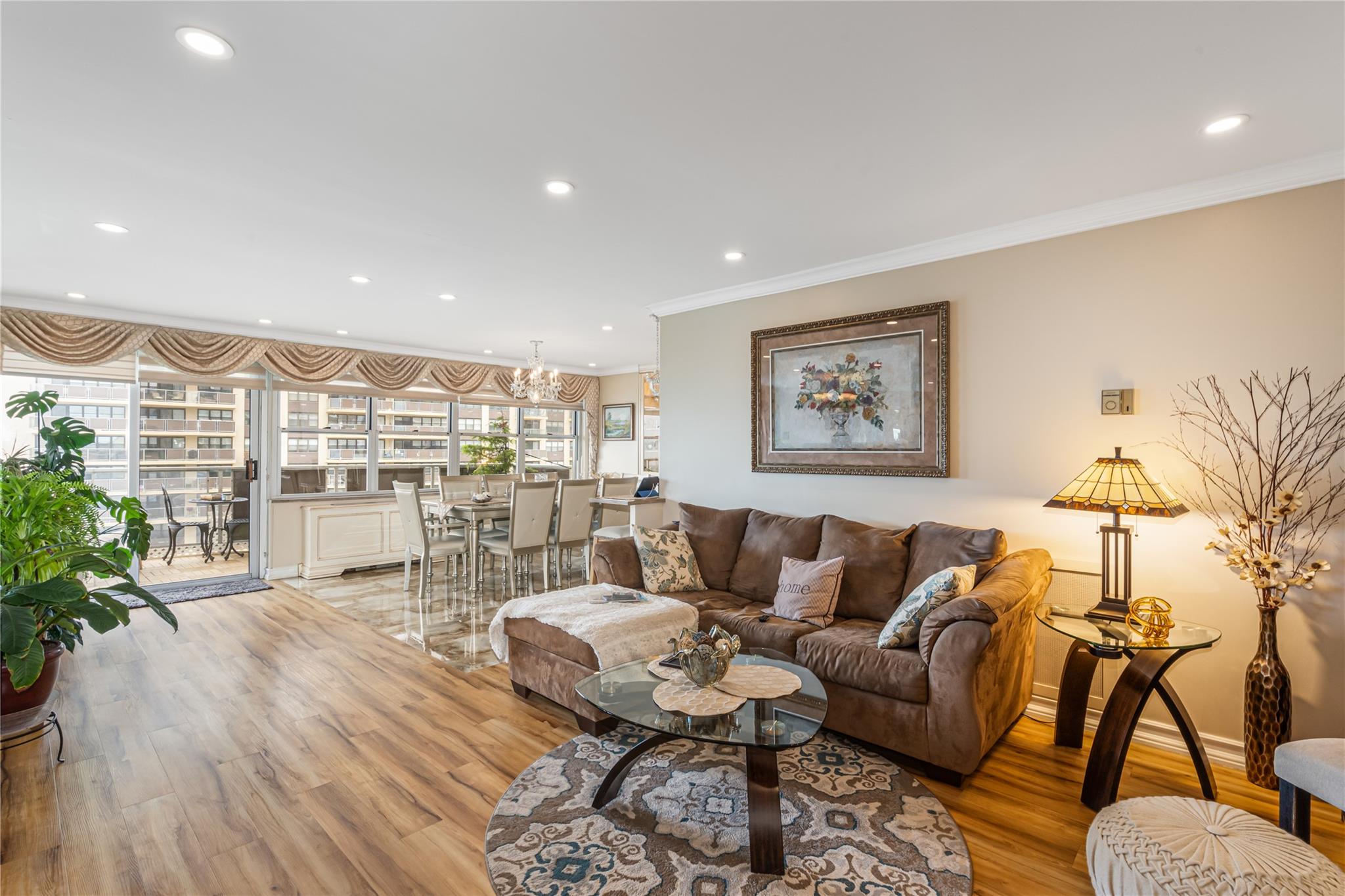 17-85 215th Street, Unit 4M Queens, NY 11360 - Photo 4 of 41 Living room featuring crown molding, light wood-style floors, and recessed lighting