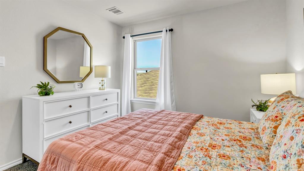 124 Pheasant Run Road Terrell, TX 75160 - Photo 6 of 35 Bright room featuring a window with white curtains, white walls, and dark-framed window