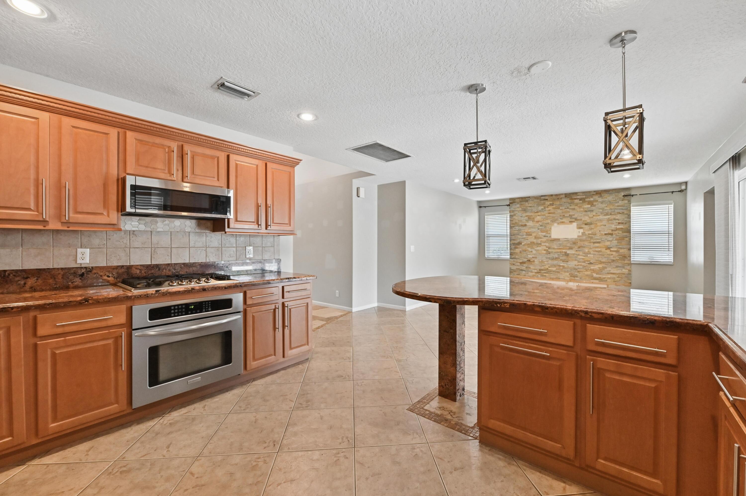 1163 Peninsula Way Greenacres, FL 33413 - Photo 9 of 40 16 Kitchen 04