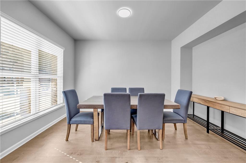 6095 Marigold Way Atlanta, GA 30349 - Photo 2 of 17 a view of a dining room with furniture and a window