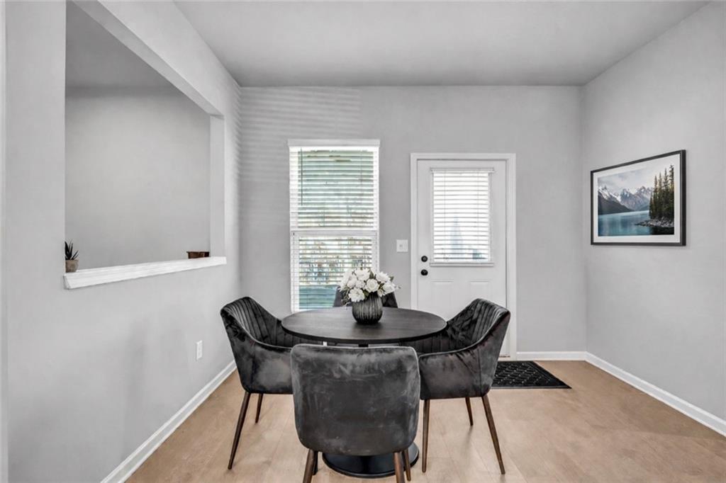 6095 Marigold Way Atlanta, GA 30349 - Photo 5 of 17 a dining room with furniture and window