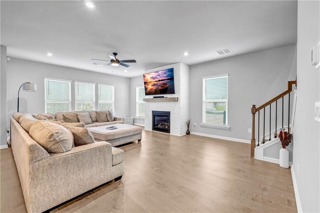 6095 Marigold Way Atlanta, GA 30349 - Photo 6 of 17 a living room with fireplace furniture and a flat screen tv