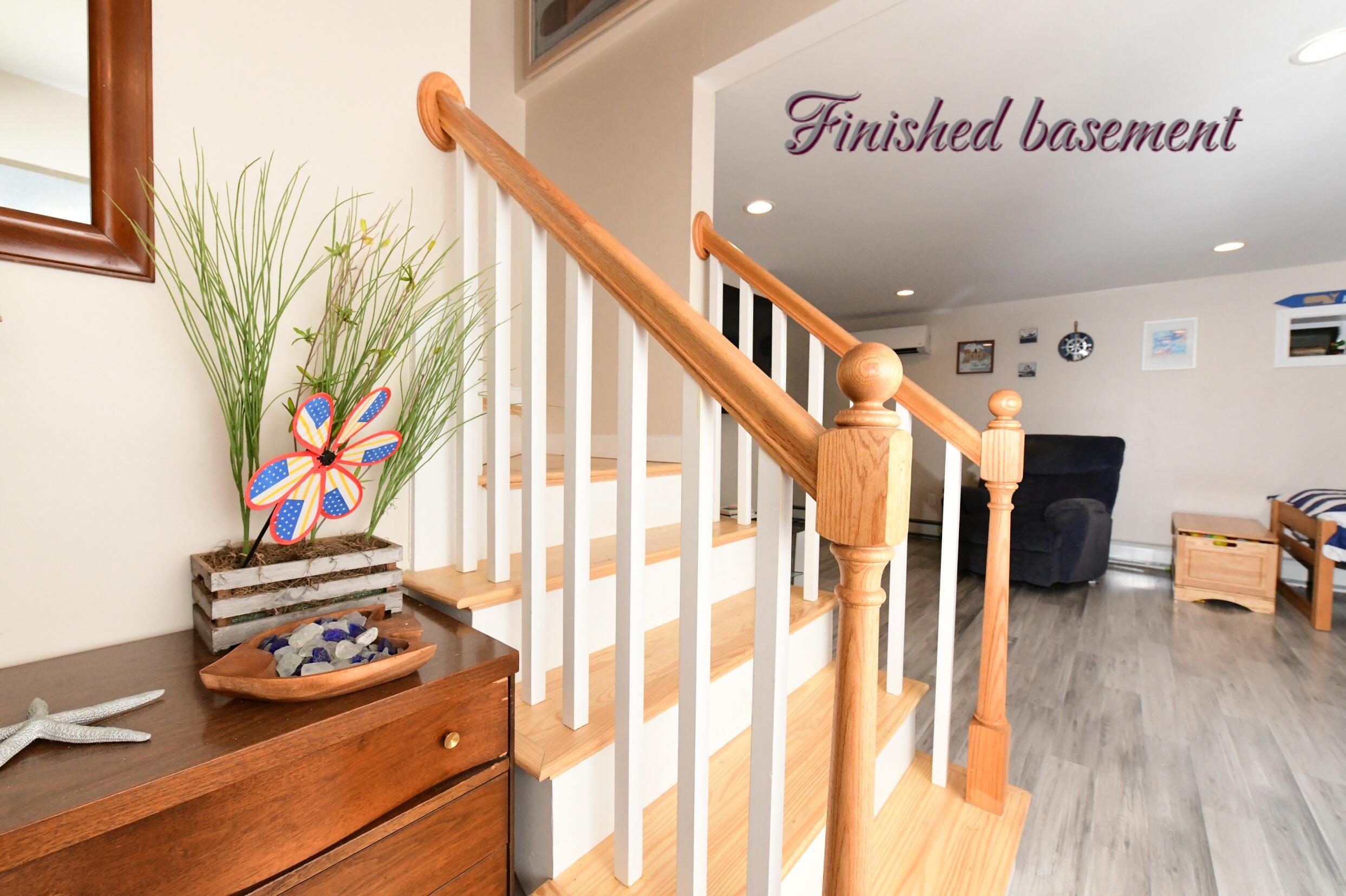 173 Standish Road Sagamore Beach, MA 02562 - Photo 18 of 39 a view of a hallway with wooden floor and furniture