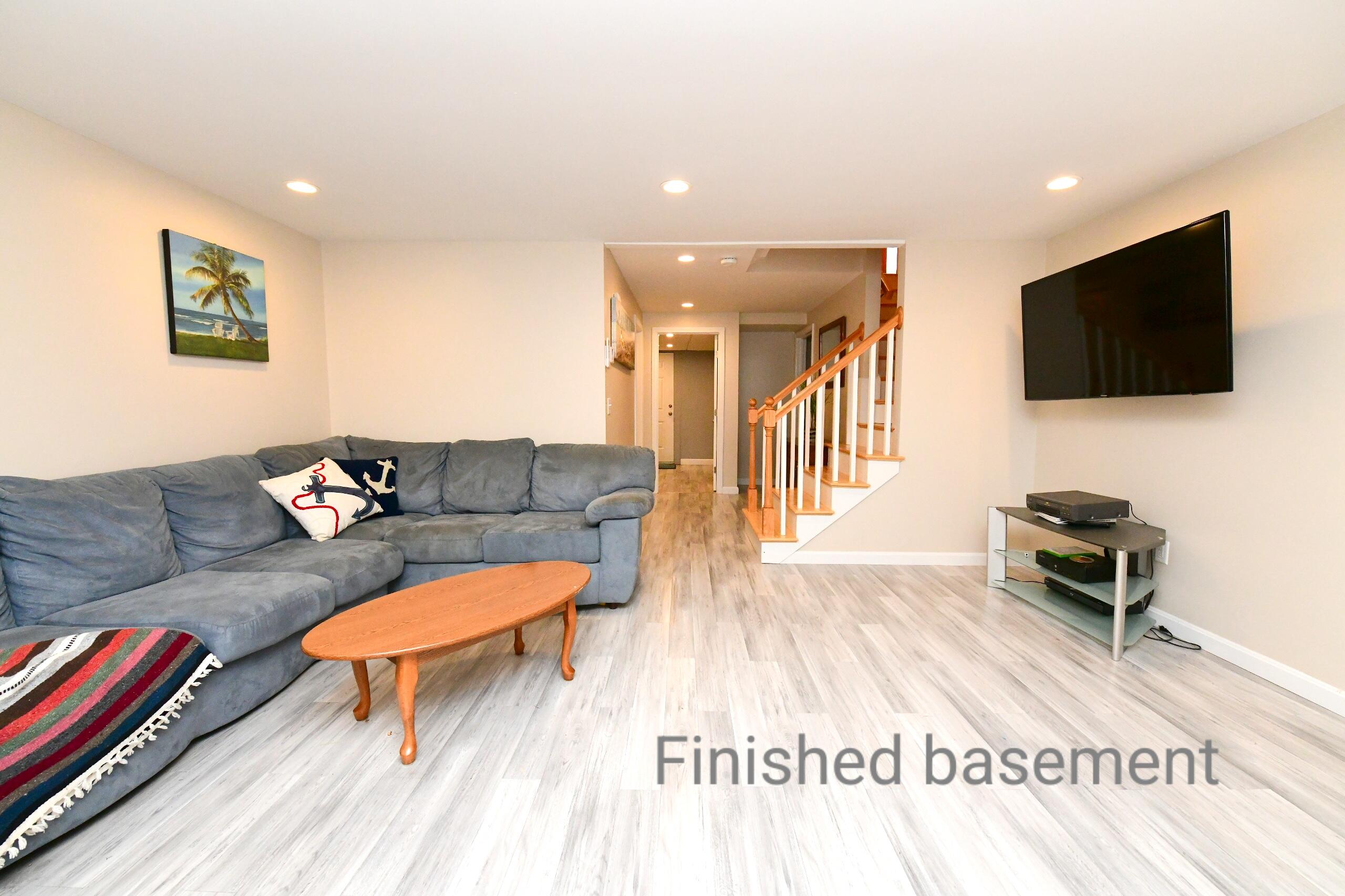 173 Standish Road Sagamore Beach, MA 02562 - Photo 19 of 39 a living room with furniture and a flat screen tv