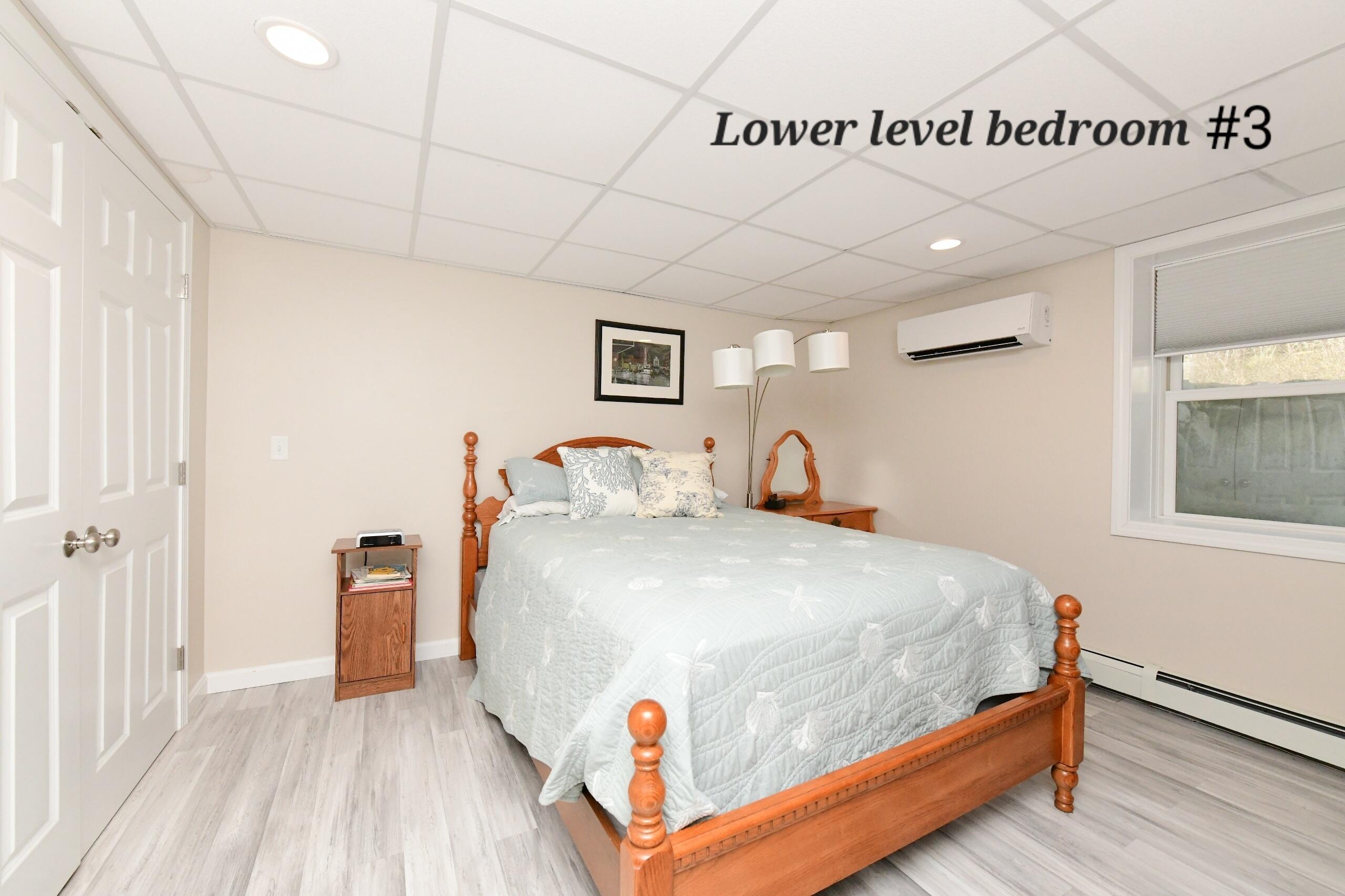 173 Standish Road Sagamore Beach, MA 02562 - Photo 20 of 39 a bedroom with bed and wooden floor