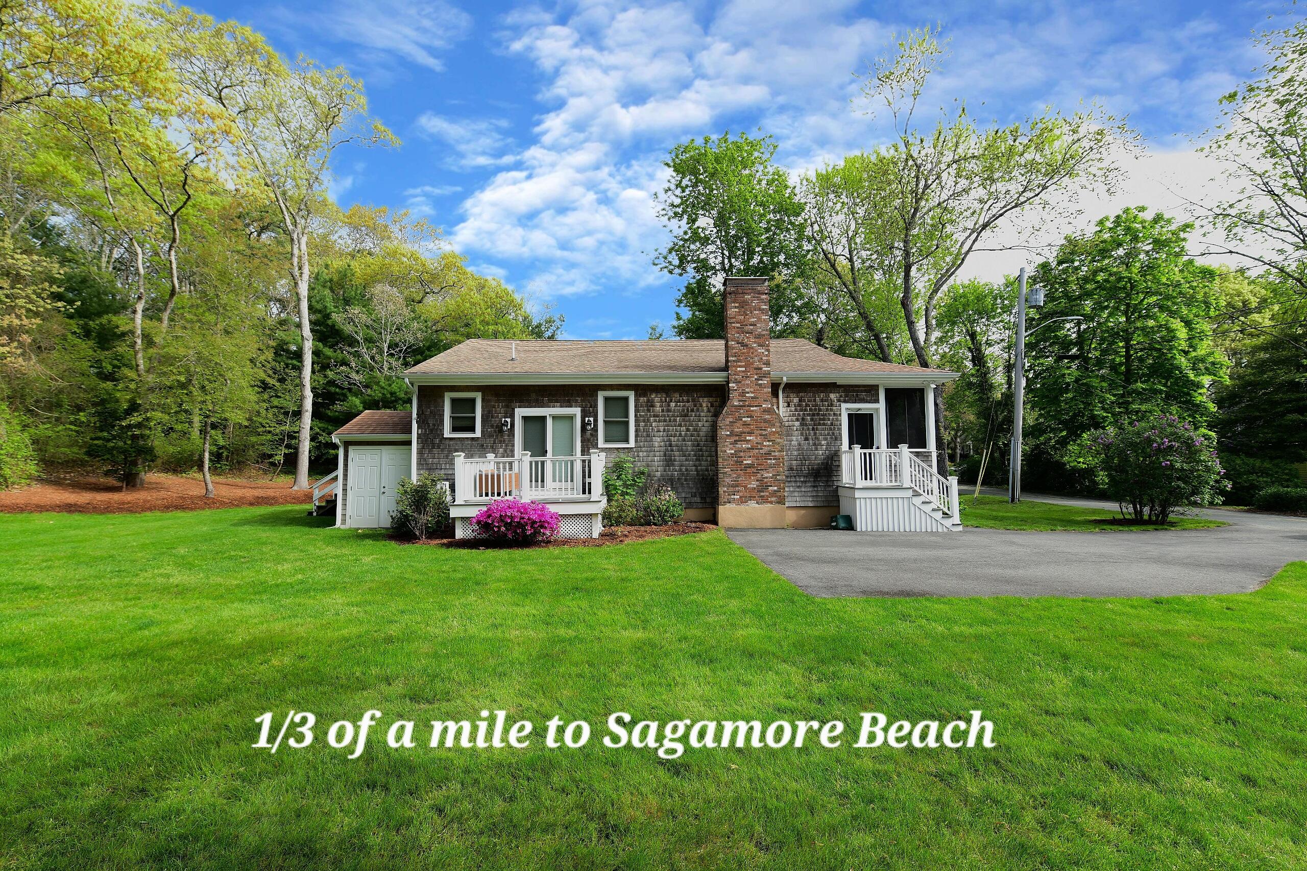 173 Standish Road Sagamore Beach, MA 02562 - Photo 28 of 39 a view of a house with a yard