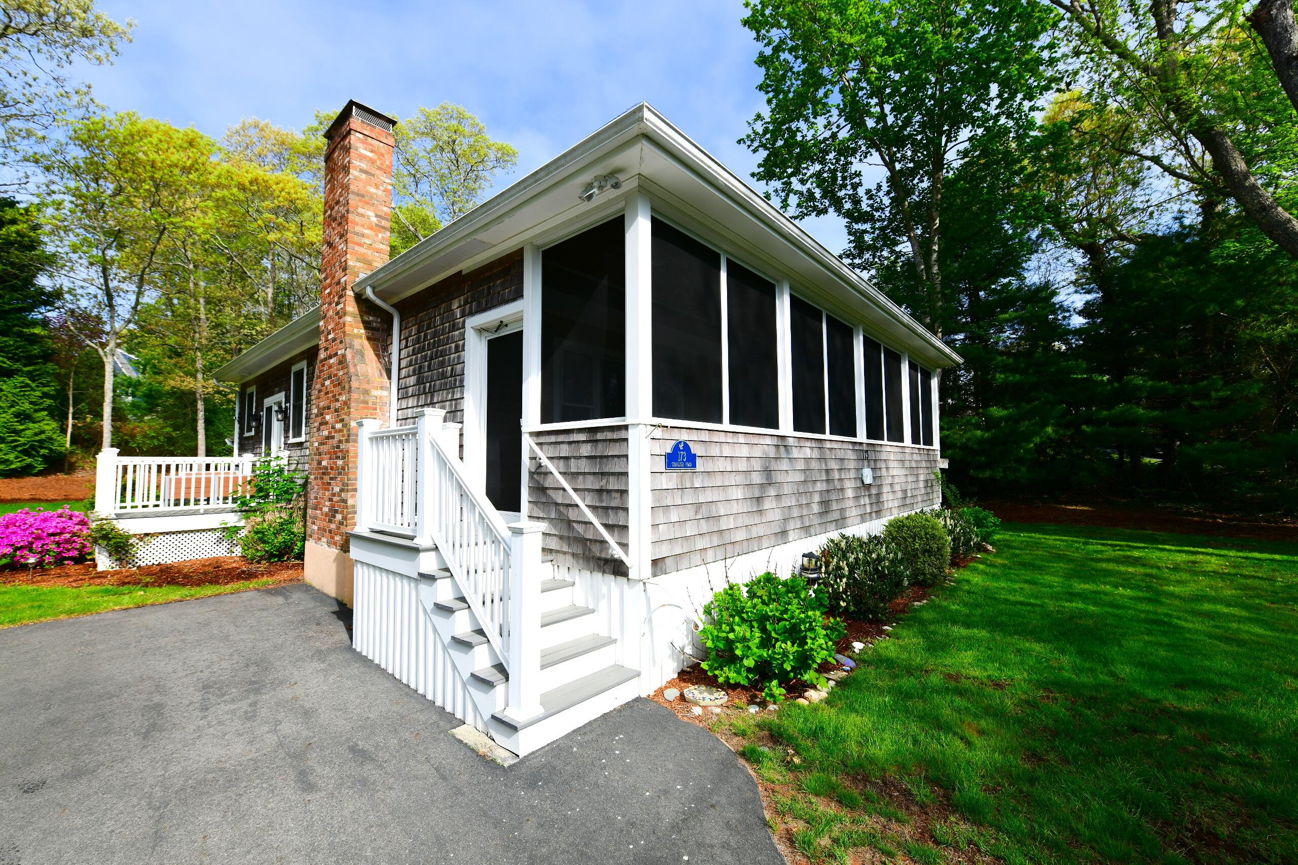 173 Standish Road Sagamore Beach, MA 02562 - Photo 33 of 39 a front view of a house with garden