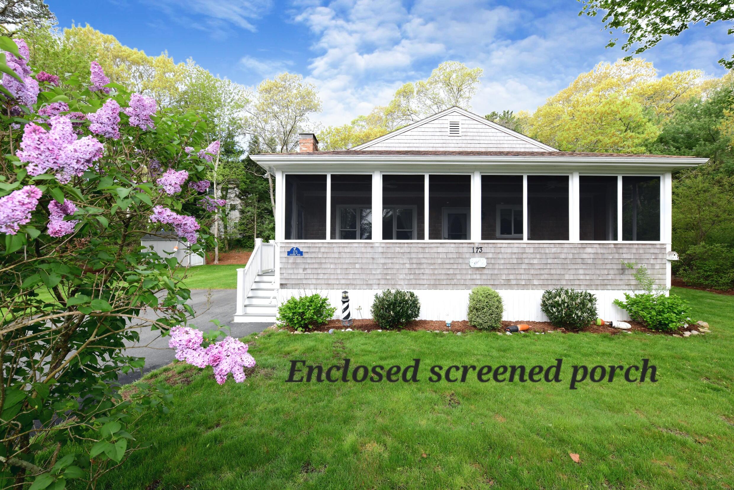173 Standish Road Sagamore Beach, MA 02562 - Photo 4 of 39 a front view of a house with a yard and fountain