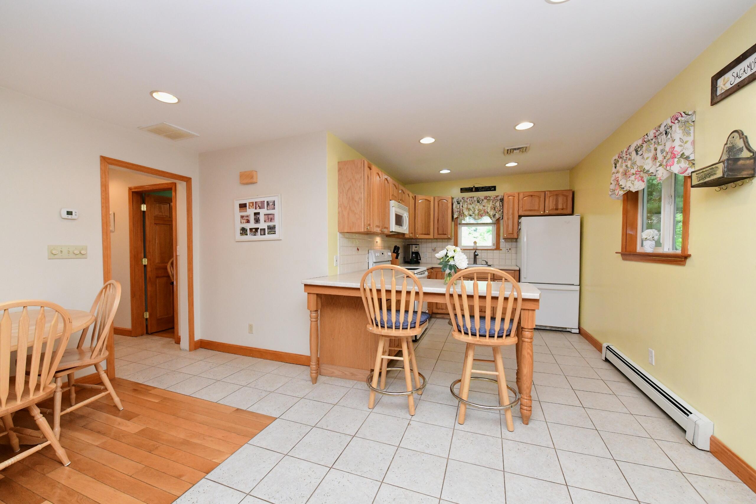 173 Standish Road Sagamore Beach, MA 02562 - Photo 8 of 39 a view of a dining room with furniture