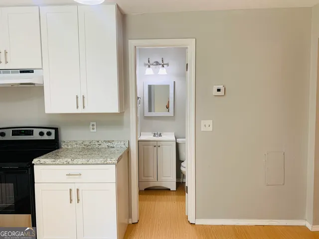 a kitchen with a sink and a refrigerator