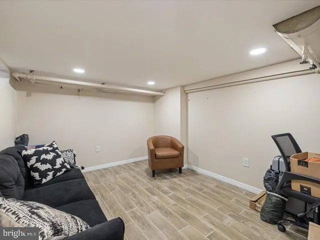 a bedroom with a bed and a chair