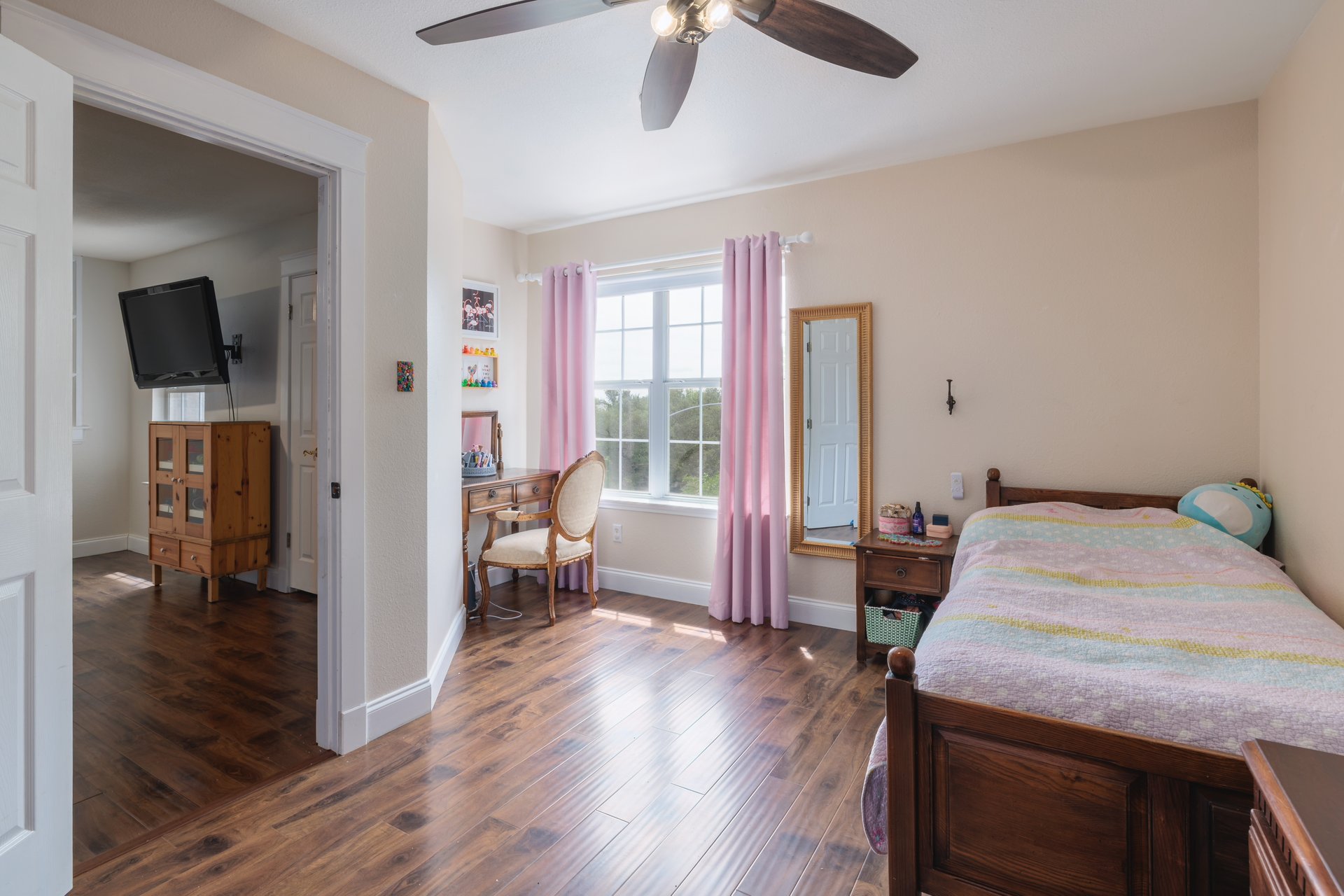 7000 Bending Oak Road Austin, TX 78749 - Photo 28 of 39 a bedroom with a bed and wooden floor