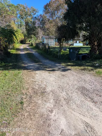 a view of backyard with green space