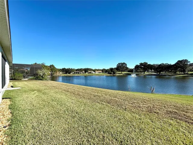 a view of a lake with houses in the background