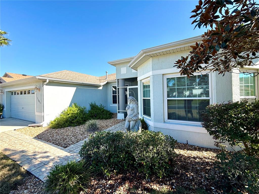 15425 Southwest 14th Avenue Road Ocala, FL 34473 - Photo 4 of 21 a front view of a house with a yard