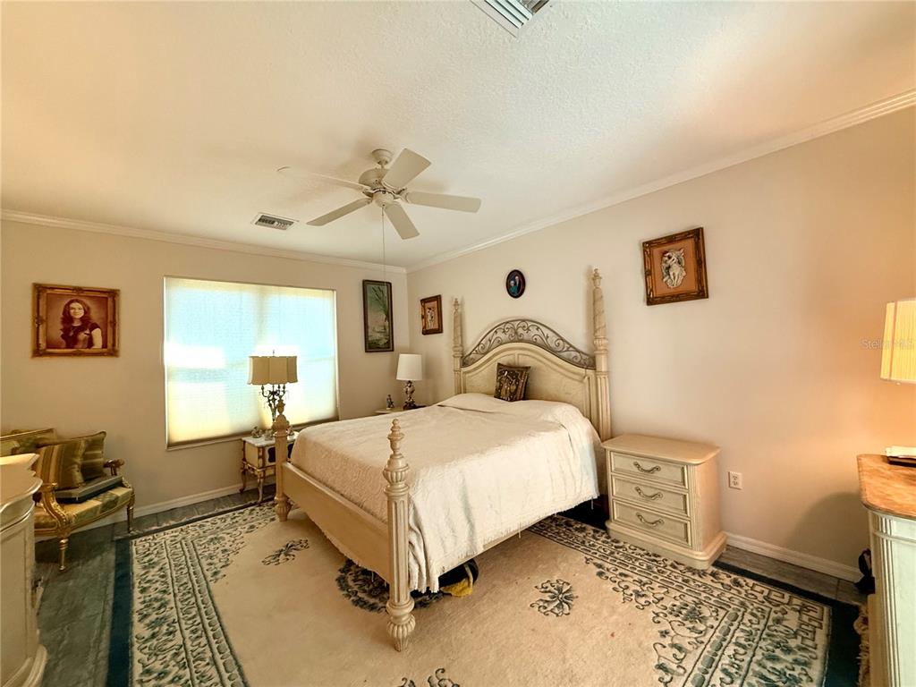 15425 Southwest 14th Avenue Road Ocala, FL 34473 - Photo 9 of 21 a bedroom with a bed and a table