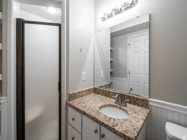 1446 West 1450 North Layton, UT 84041 - Photo 13 of 16 Bathroom vanity featuring a granite-look countertop with an integrated oval sink and brushed nickel faucet