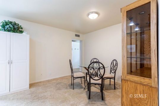 1016 Peg Street Ridgecrest, CA 93555 - Photo 14 of 26 a view of a room with furniture and a window