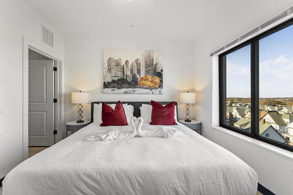 600 Broadway, Unit 405 Chelsea, MA 02150 - Photo 5 of 28 a bedroom with a bed and window