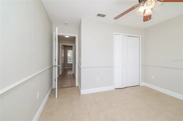 a view of an empty room and closet