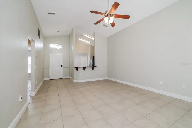 an empty room with a bathroom and a shower