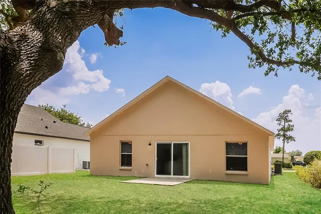 a view of a back yard of the house
