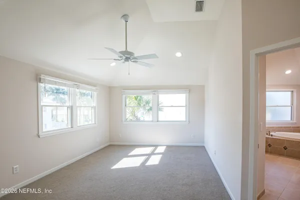a view of an empty room with a window