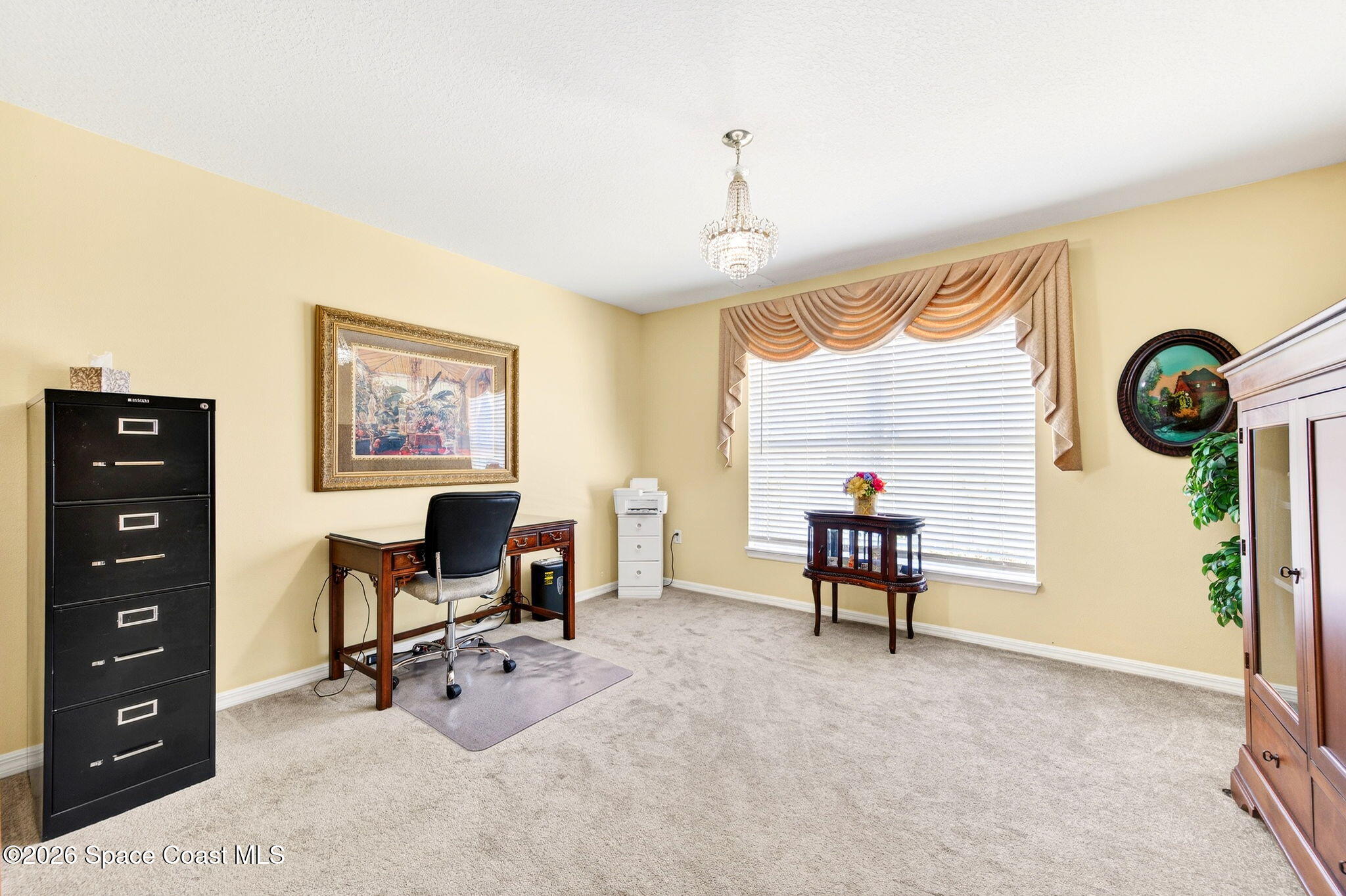 2186 Spring Creek Circle Palm Bay, FL 32905 - Photo 21 of 40 a view of a workspace with furniture and a window